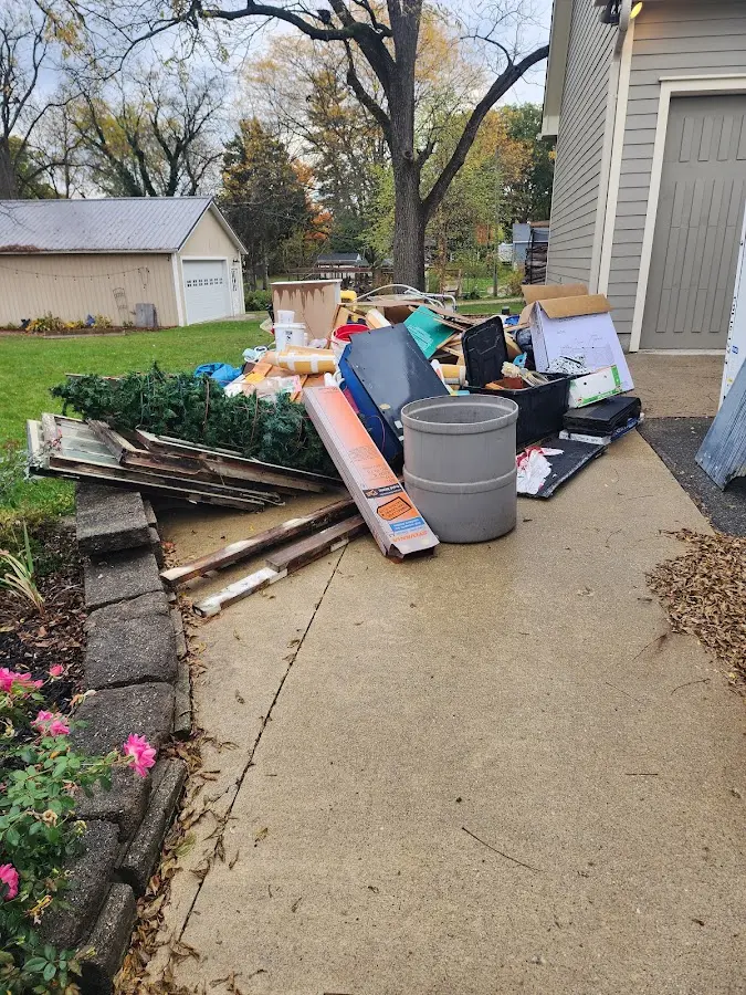 Dumpster being loaded with debris for Demolition Dumpster Rental in Wayne
